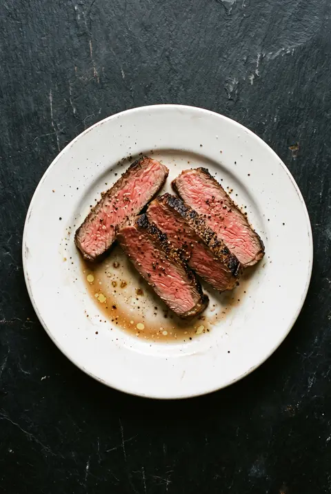 Steak, about 100 g, on a white plate