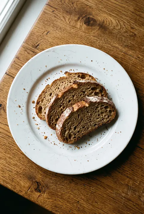 Bread, about 100 g, on a white plate