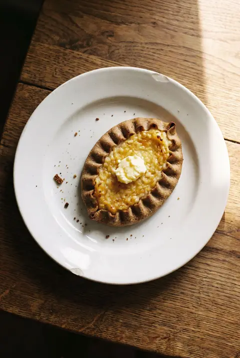 A Karelian pie on a white plate