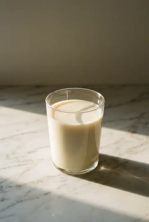 Unsweetened soy milk in a clear glass