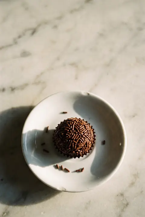 A brigadeiro on a white plate