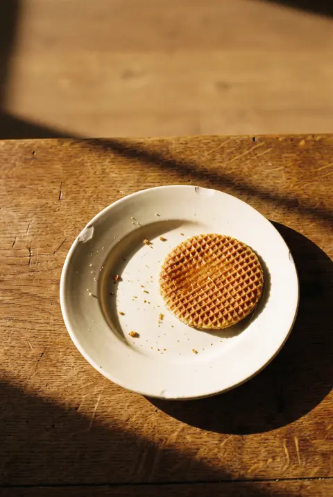 A Dutch stroopwafel on a white plate