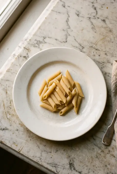 Pasta, about 100 g, on a white plate